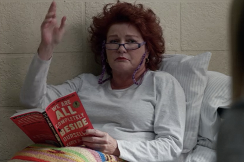 The former and fallen Commander Janeway aka Red waving tiredly from her bunk in Litchfield Federal Penitentiary