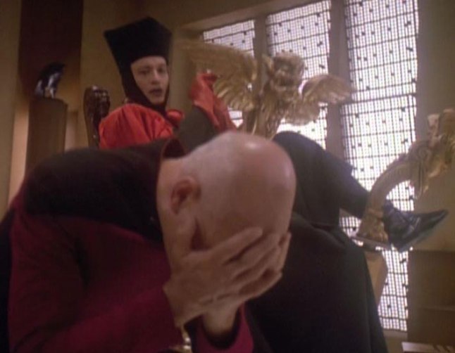 Q and Picard, face in his hands