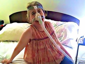 Cartoon image of Ingrid Tischer lounging on a bed, wearing her Bi-PAP S/T mask.
